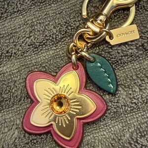 Coach Wildflower Bag Charm in pink multicolor with gold finish- NWOT